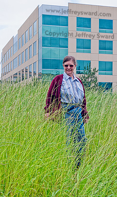 The Dwarf stands in a field of waist-to-shoulder-high uncut grass in a commerical district of Irvine as mandataed by the City of Irvine