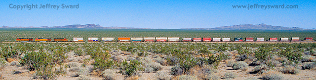 BNSF frieght near route 66 in Mojave Desert Simplicity Photograph by Jeffrey Sward
